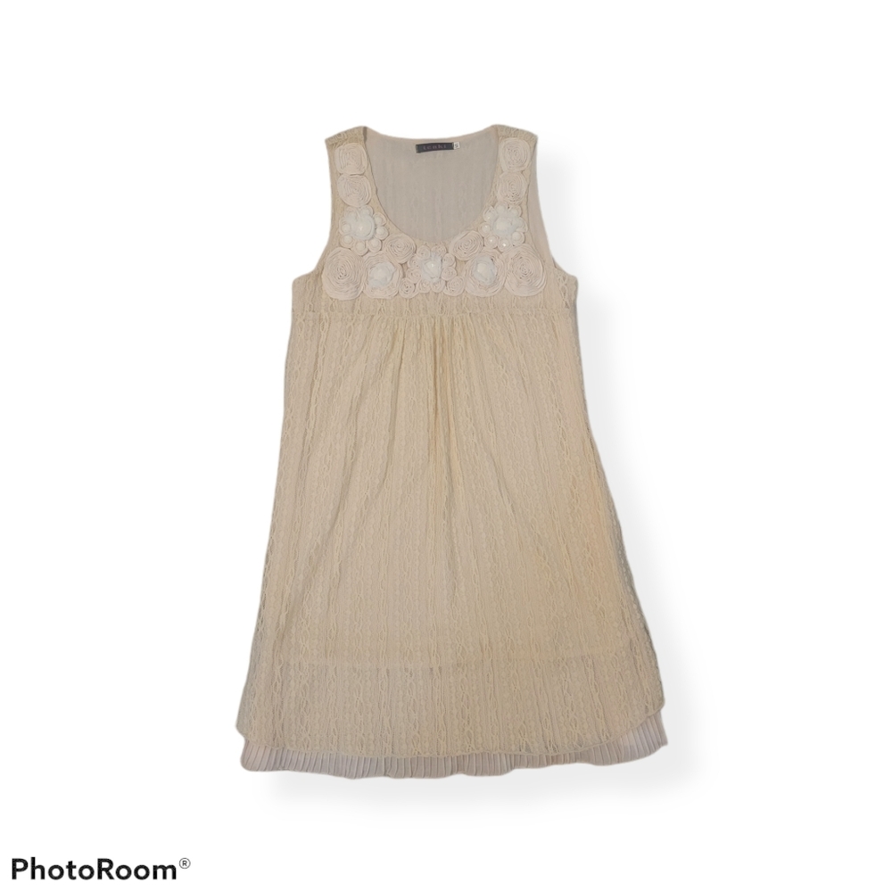 Sleeveless dress with embellished neckline